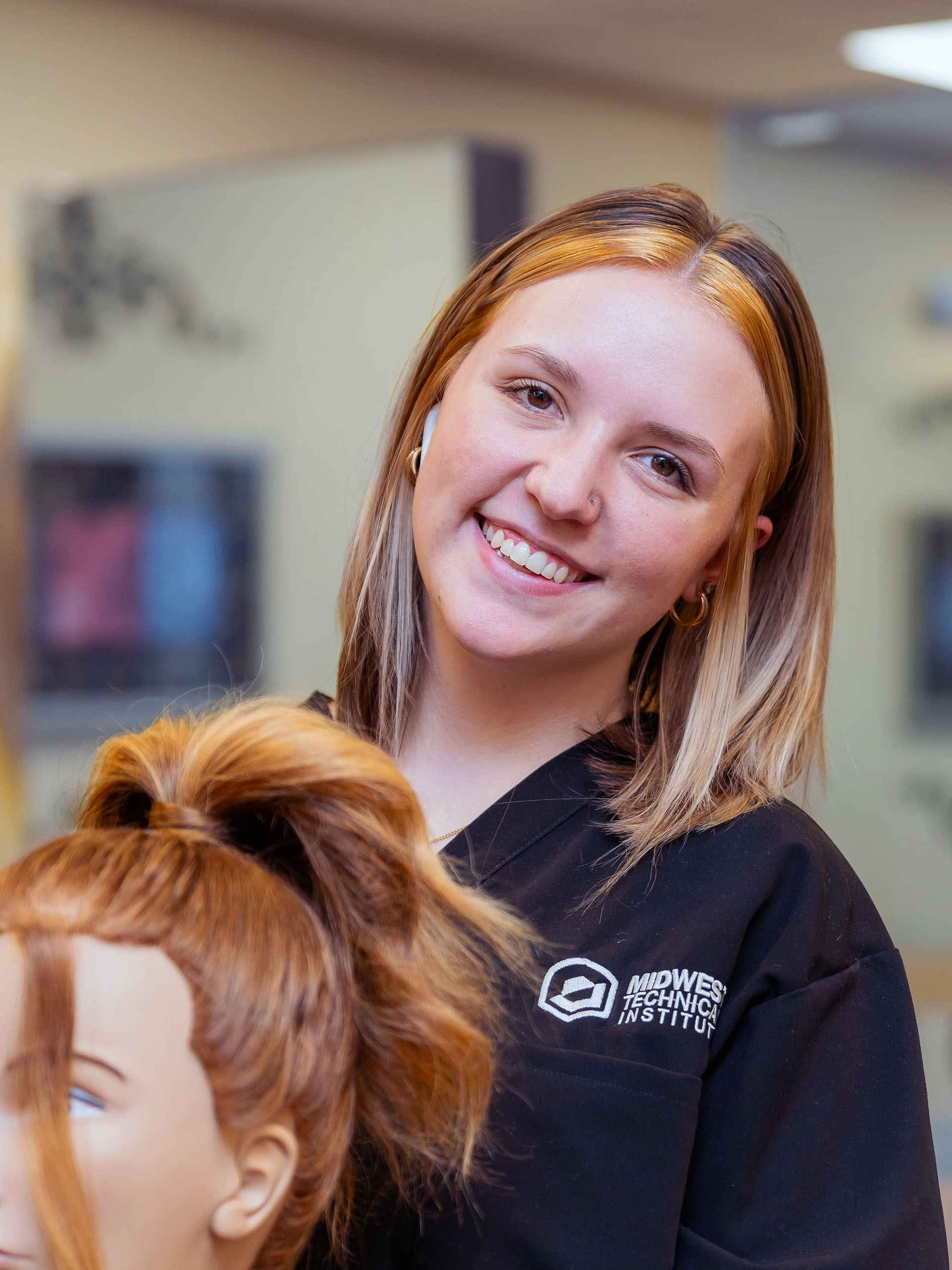 Cosmetology Program Student Styling Hair