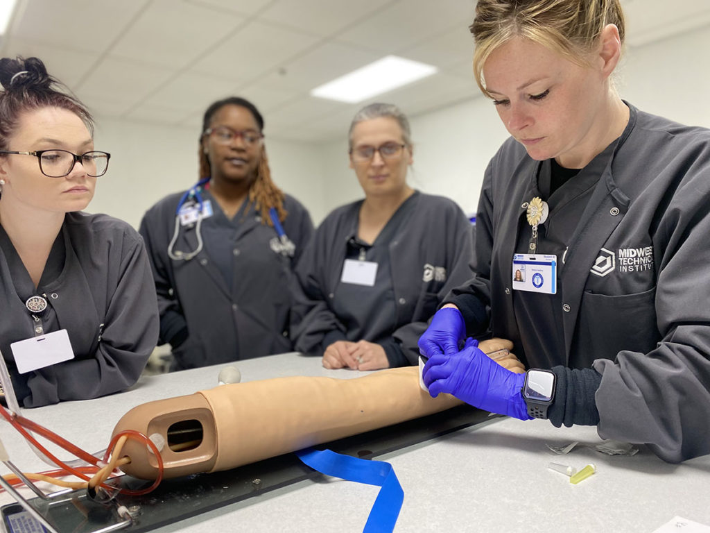 Medical Assisting Program Students Practicing Blood Drawing